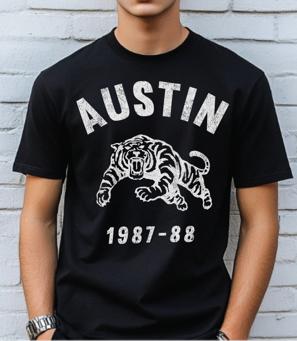 Boys black tshirt with tiger on it that says "Austin" 