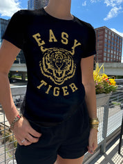 Easy Tiger dark blue tee shirt with gold font on a women in Minneapolis with Tiger Print