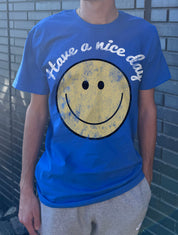 Blue mens tshirt that says "Have a nice day" with a smiling face