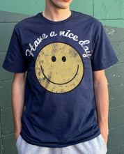 Dark blue men's tshirt that says "Have a nice day" with a smiling face