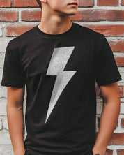 Boys black tee shirt with a white lightning bolt symbol on the front