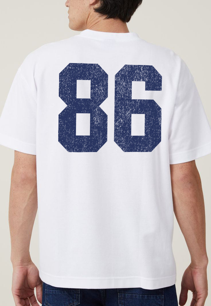 white t-shirt for boys that says "86" on it in blue from the back