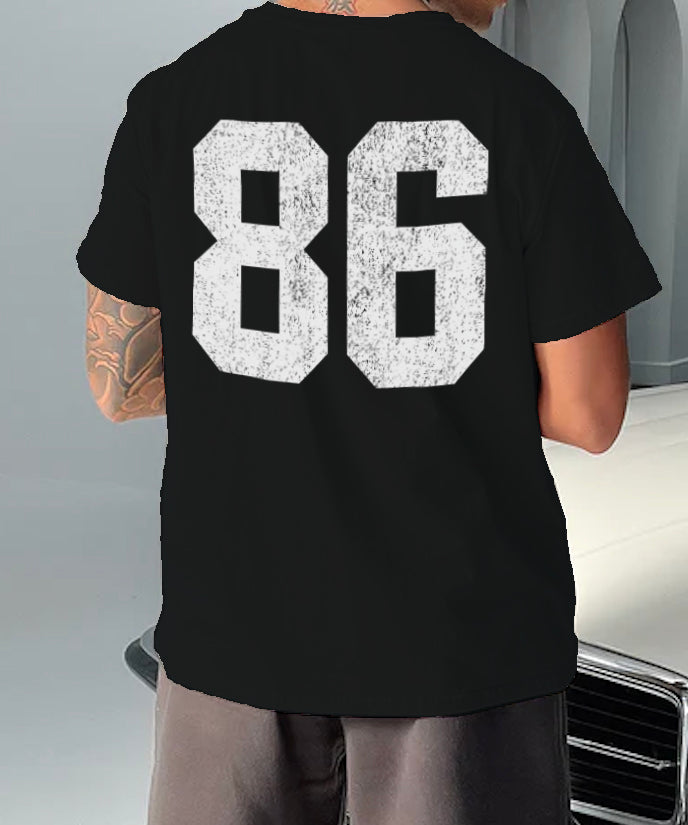 black tshirt that has "86" in whit text on it 