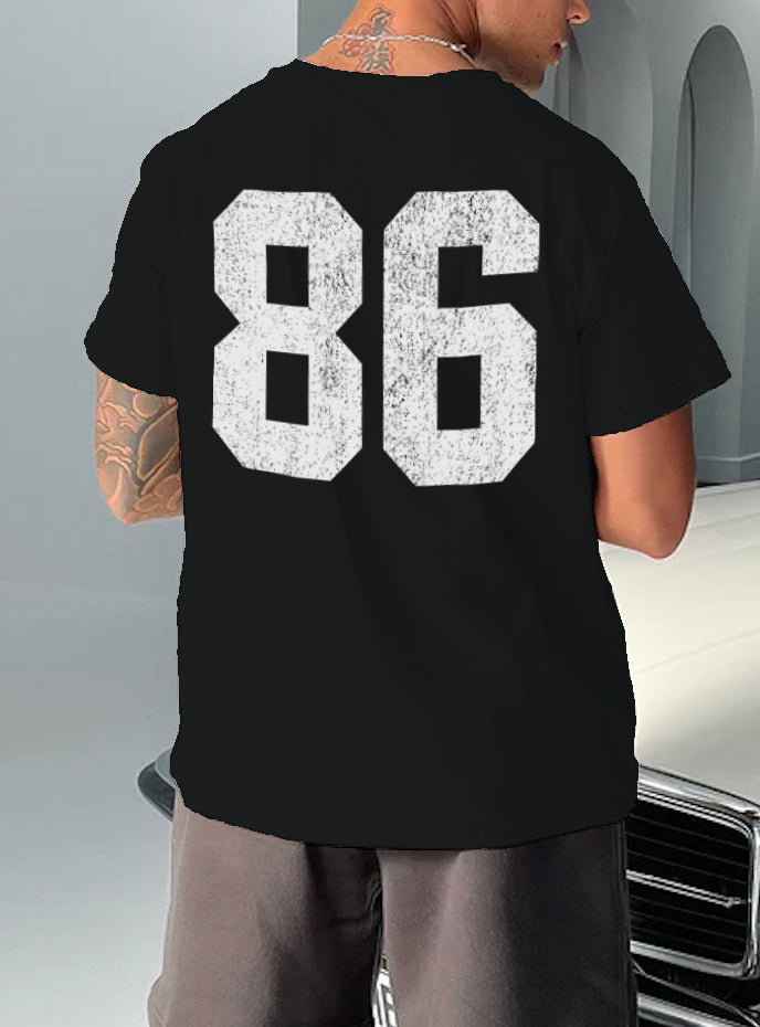 black tshirt that has "86" in whit text on it 