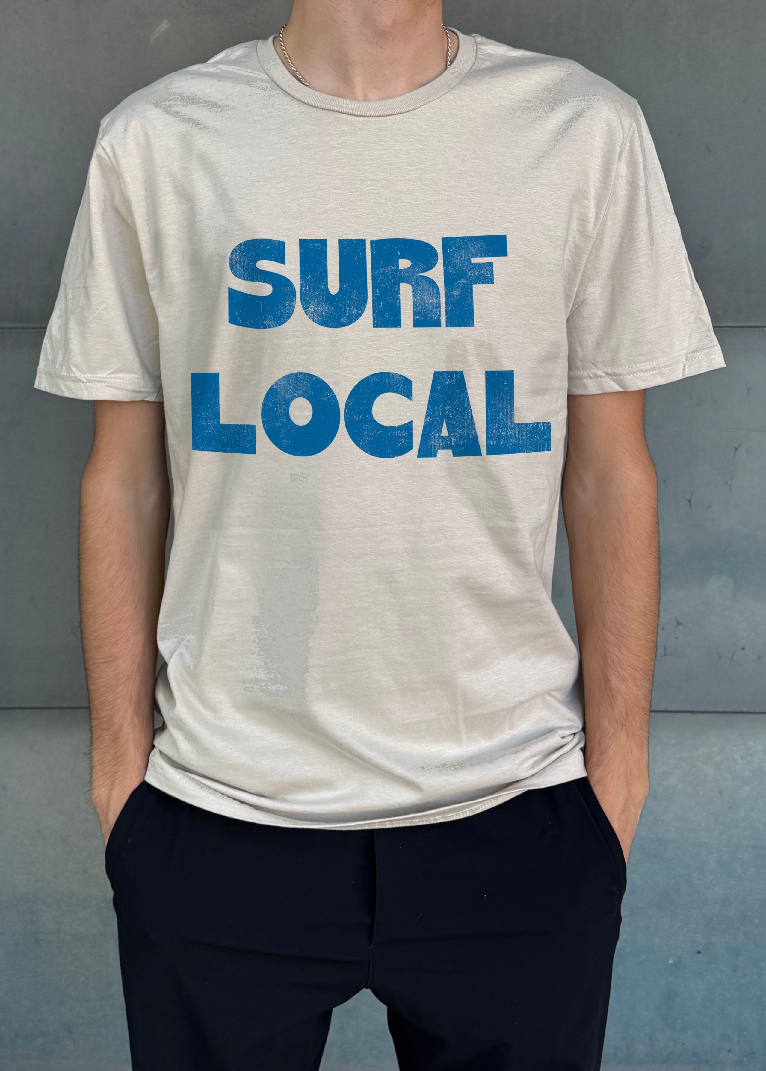 white shirt with blue text that says "Surf Local" for boys