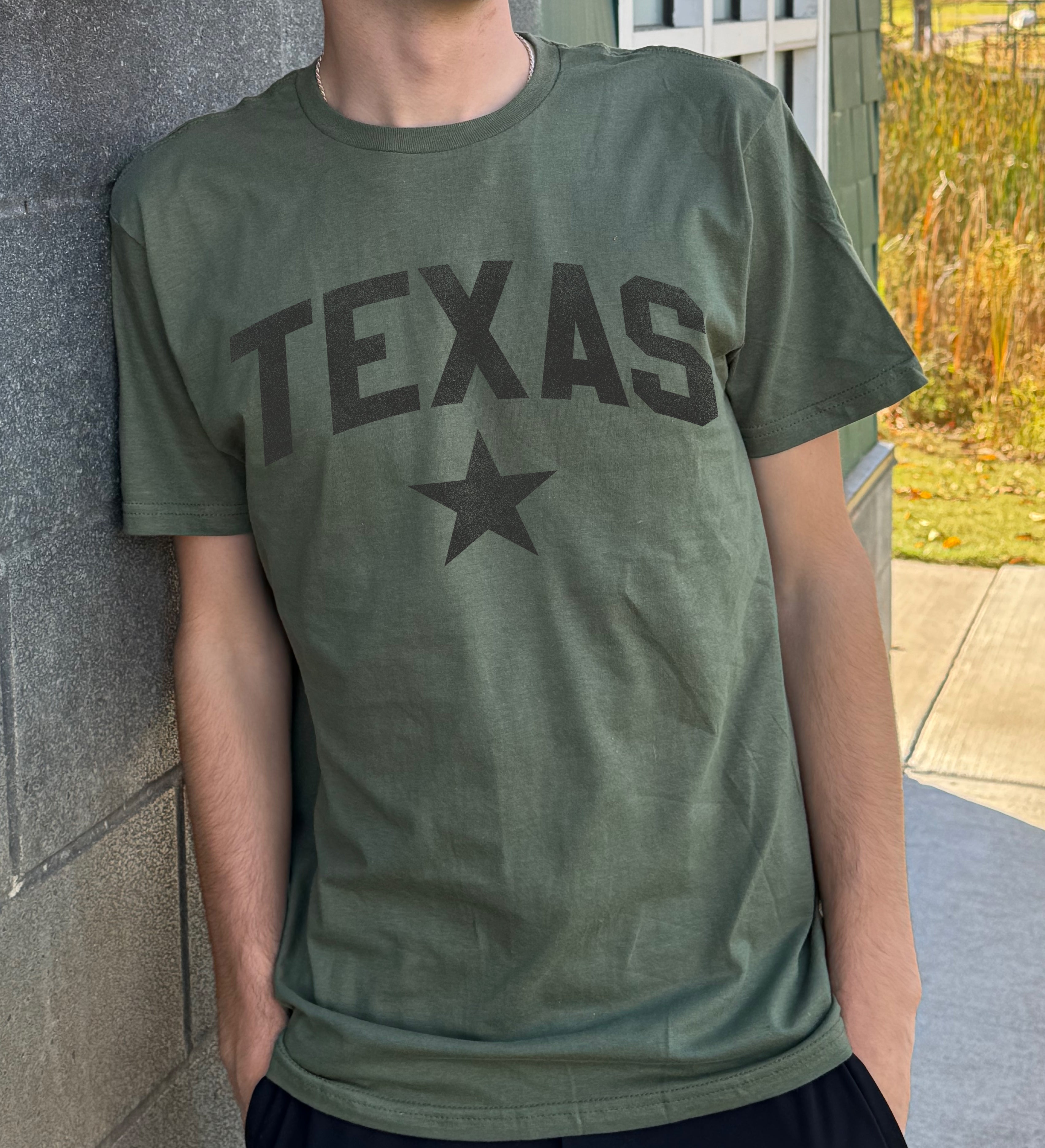 Dark Green men's t-shirt with "Texas" in gray font