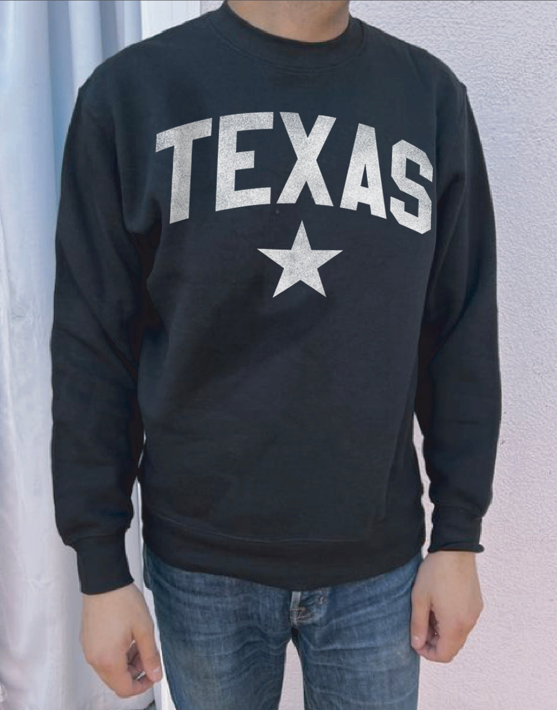 Black pullover with white text that says "Texas"