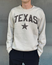 Sand colored pullover with brown text that says "Texas"