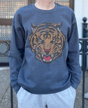 Grey pullover with tiger head tattoo image