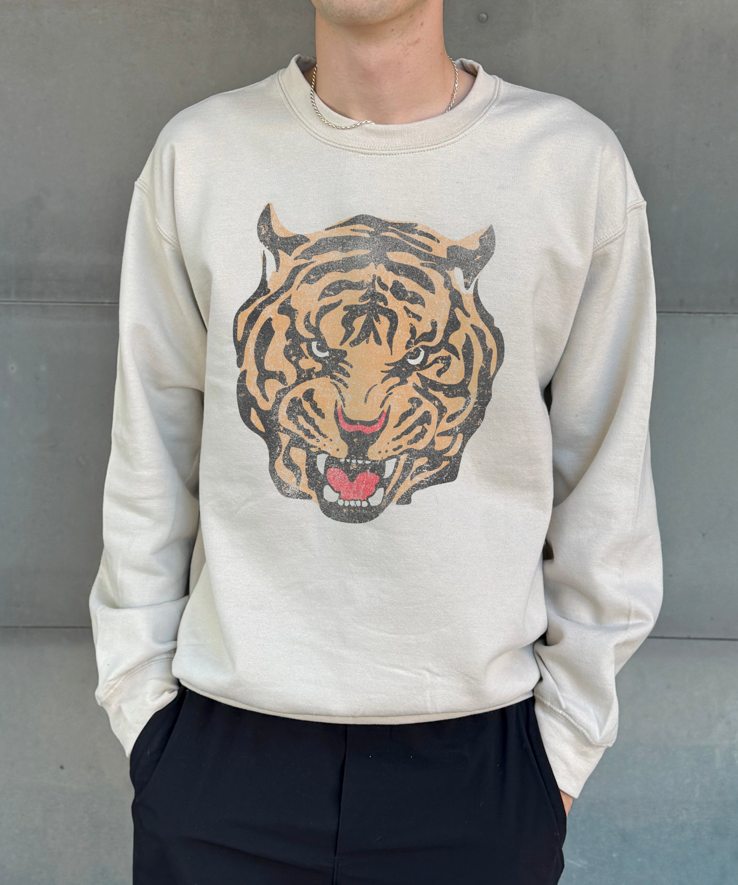 Sand colored pullover with tiger head tattoo image