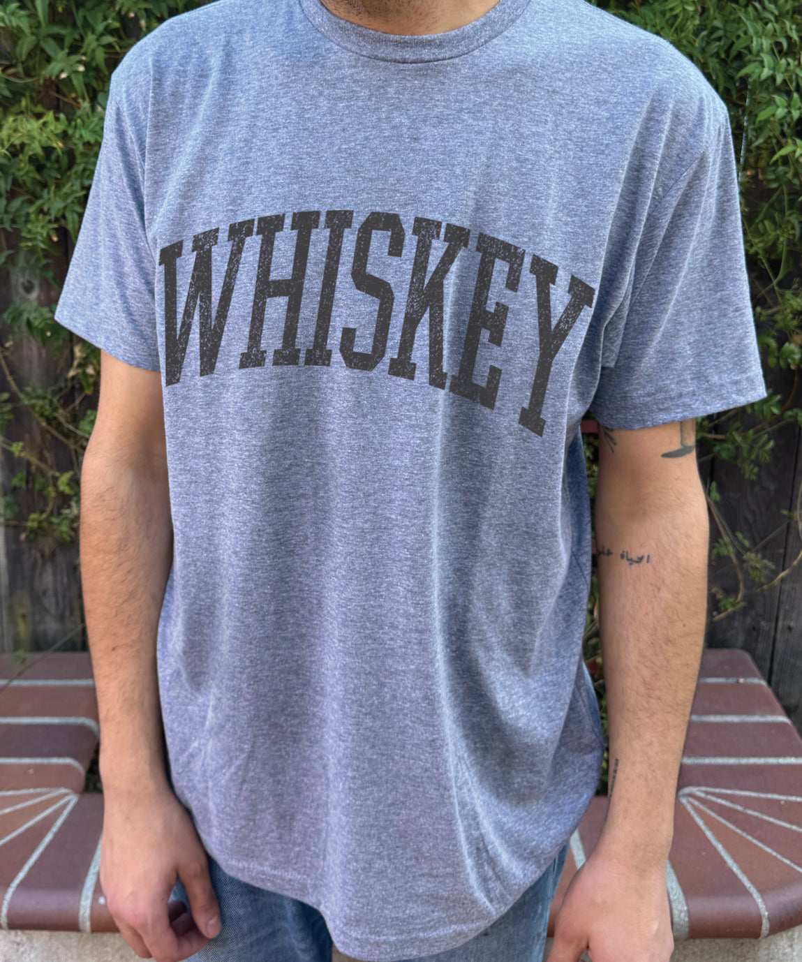 Grey men's t-shirt with "Whiskey" in brown font