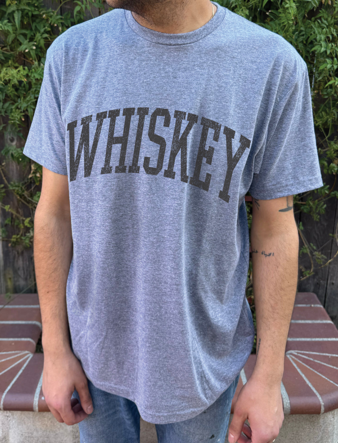 Grey men's t-shirt with "Whiskey" in brown font