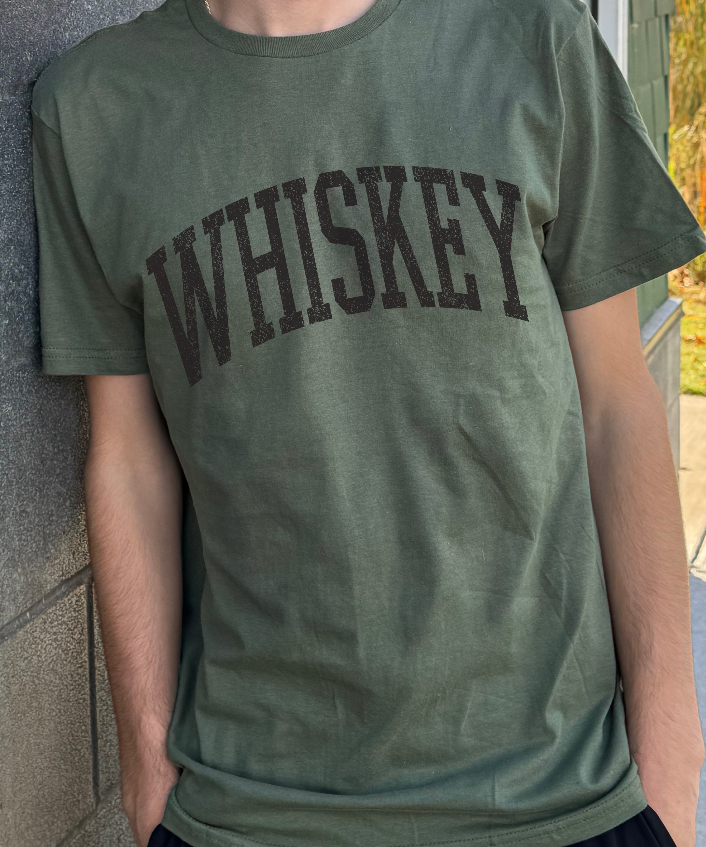 Dark green men's t-shirt with "Whiskey" in black font